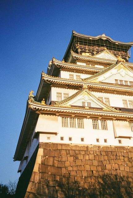A castle tower against a deep blue sky